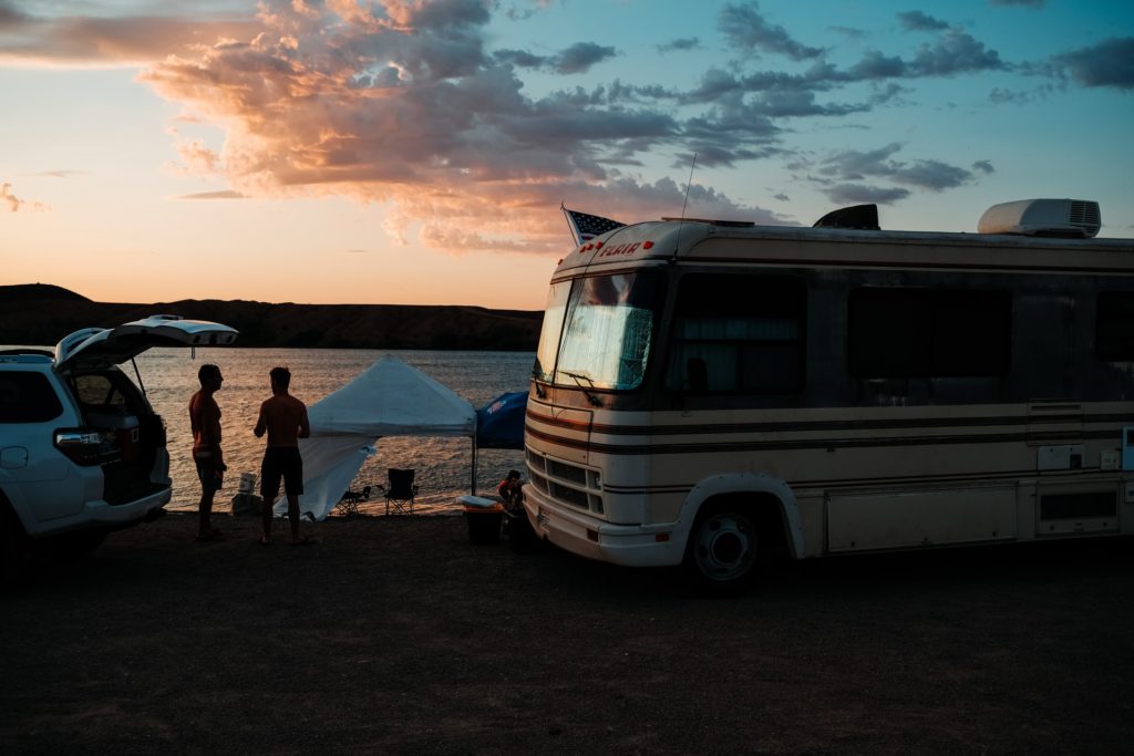 camper and people at sunset